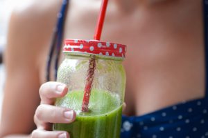 Women drinking green juice